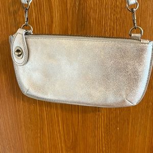 NWT silver purse with detachable strap and extra button to secure closure